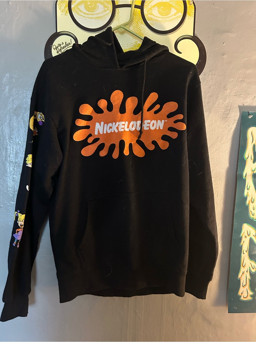 Nickelodeon Black Hoodie with Orange Splat Logo and Cartoon Sleeve